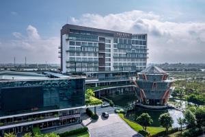 a large building with a sign on top of it at The Reed Hotel in Ninh Binh