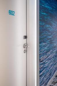 an open door with a view of the ocean at Hôtel Riva Art & Spa in Menton