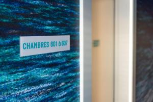 a sign that reads chaminades got to go at Hôtel Riva Art & Spa in Menton