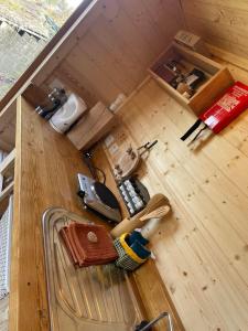 an overhead view of a tiny house with a wooden floor at La Rouloulotte in Durbuy