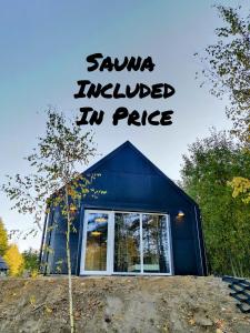 a blue house with the words sauna induced in pace at Modern Sauna Cabin in Horse Ranch in Lieplaukė