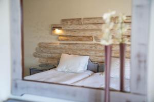 Un pat sau paturi într-o cameră la Villa Del Sol Corfu