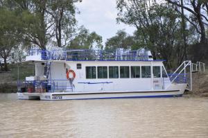 
a large white boat on a body of water at Longreach Motor Inn in Longreach
