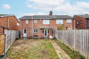 an empty yard in front of a house with a fence at 6 Bedroom Larger group House with Parking Corringham Stanford Le Hope in Horndon on the Hill