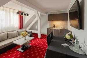 TV a/nebo společenská místnost v ubytování Hotel Berlin