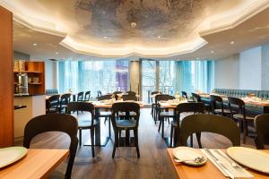 Reštaurácia alebo iné gastronomické zariadenie v ubytovaní Hotel Capricorno