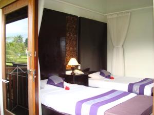 Postel nebo postele na pokoji v ubytování Anini Raka Resort & Spa