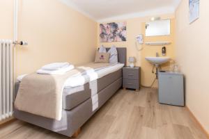 Voodi või voodid majutusasutuse Gasthaus Hinterbrühl toas