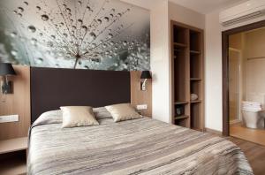 Postel nebo postele na pokoji v ubytování Hostal Centric