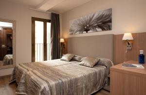 Postel nebo postele na pokoji v ubytování Hostal Centric