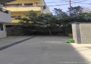 an empty parking lot in front of a building at Best Individual Home stay Near Apollo Jubilee Hills in Hyderabad