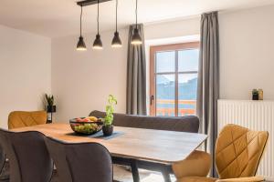 a kitchen and dining room with a table and chairs at Sparberhof Exklusive in Campo di Trens