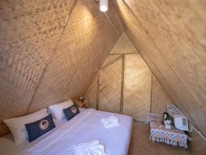 a bedroom with a bed in a tent at Yellowstone Camps Resort Sapan in Ban Huai Ti