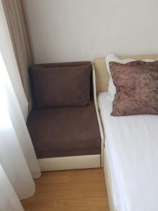 Postel nebo postele na pokoji v ubytování СТУДИО ЦЕНТЪР 2