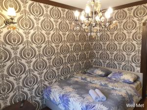 Katil atau katil-katil dalam bilik di Элитные апартаменты в самом респектабельном районе Алматы