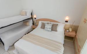 Postel nebo postele na pokoji v ubytování Hotel Teti