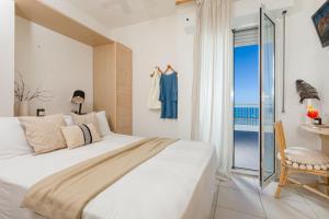 Postel nebo postele na pokoji v ubytování Hotel Teti