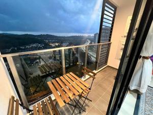 a balcony with chairs and a view of a city at Putra Homestay, Presint 15, Near Alamanda Mall & Presint Diplomatik in Putrajaya