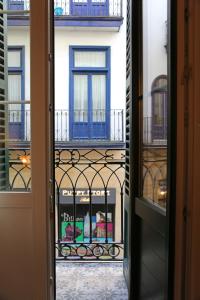 a view of a store from an open door at Apartamento Premium en Pleno Casco Viejo de Bilbao in Bilbao