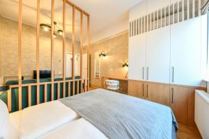 a bedroom with a bed and a desk at Designer Central Getaway in Cluj-Napoca +23 photos