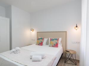 A bed or beds in a room at Preciosa Casa Terraza Privada 2hab 2baños AC