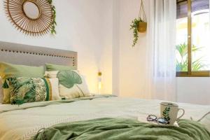 A bed or beds in a room at Apartamento Pink Arena Még 22 kép