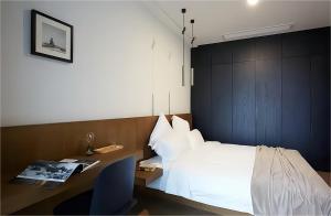 Postel nebo postele na pokoji v ubytování base-PUSAN Serviced Apartment -Shanghai New International Expo Centre