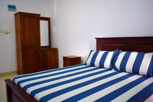 Uma cama ou camas num quarto em Catamaran6 Guest Inn