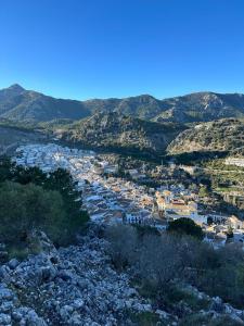 a view of a town with houses and mountains at Casa Lucas in Grazalema