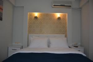 Ein Bett oder Betten in einem Zimmer der Unterkunft Marla Didim Otel