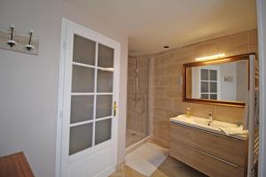 a bathroom with a sink and a mirror at La maison de marie in Saint-Germain-les-Belles +20 photos