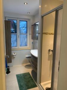 a bathroom with a toilet and a sink at Apartment II Am Jakobsweg in Erfurt