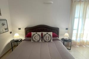 Postel nebo postele na pokoji v ubytování Corso Umberto Rooms