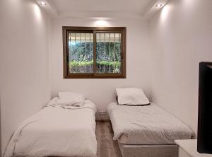 Posteľ alebo postele v izbe v ubytovaní Château de la Pinede