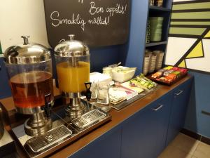 a drink bar with a blender on a counter at NETIZEN Budapest Centre in Budapest