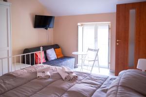 a bedroom with a bed with two pillows on it at Agriturismo Casa Scola in Gragnano