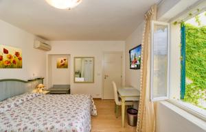 a bedroom with a bed and a window at B&B Da Pio in Pietrasanta +139 photos