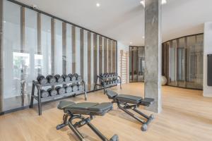 a gym with a row of exercise equipment in a room at Colinas - Ancor 2,3 POOL VIEW 1B in Palm-Mar +5 photos