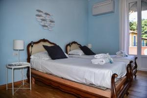 Кровать или кровати в номере Villa Perledina by Wonderful Italy