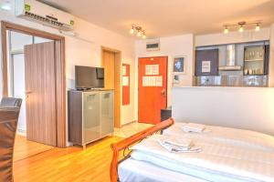 Posteľ alebo postele v izbe v ubytovaní Budapest Center Apartments