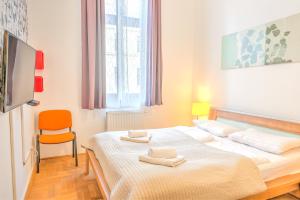 Postel nebo postele na pokoji v ubytování Budapest Center Apartments