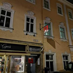 a building with windows and a sign on it at arte vida boutique guesthouse in Salzburg