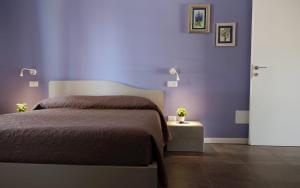 Postel nebo postele na pokoji v ubytování Villa Athena Charme + 11 fotografií