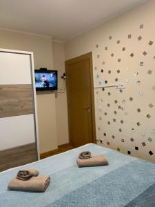 Postel nebo postele na pokoji v ubytování Apartman & SPA Andria