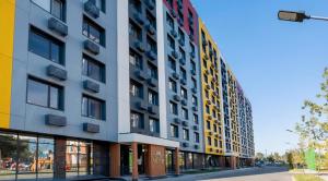 a colorful building on a city street at Bright Studio with Mountain View in Almaty