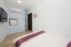 Katil atau katil-katil dalam bilik di Hana B&B