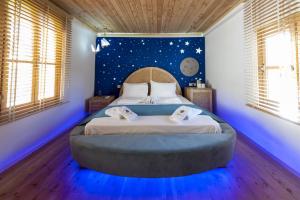 A bed or beds in a room at The Little Prince Boutique Otel