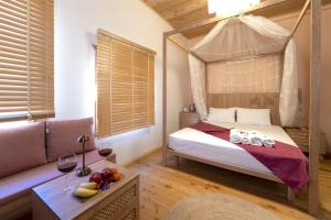 A bed or beds in a room at The Little Prince Boutique Otel