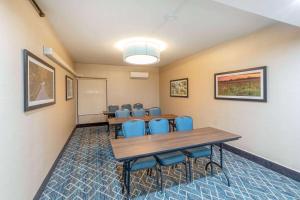 a meeting room with a long table and chairs at La Quinta by Wyndham Jonesboro in Jonesboro