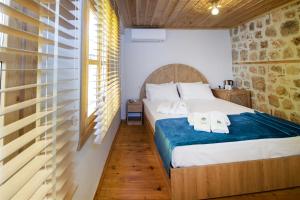 A bed or beds in a room at The Little Prince Boutique Otel